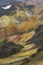 Small river between colourful rhyolite mountains, volcanic landscape, erosion landscape, view from