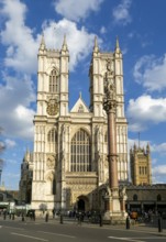 Towers and frontage of Westminster abbey church with Victoria Tower in background, Westminster,