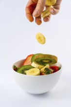 Introducing ingredients from above, recipe for a fruit salad with kiwis, strawberries, bananas