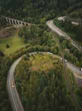 Winding road surrounded by forest and viaduct, Ravenna Gorge, Black Forest, Germany
