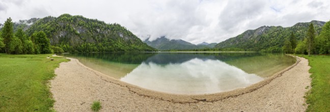 Landscape of Lake Offensee after rain when the sun comes through the clouds in spring,