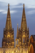 Cologne Cathedral and the Hohenzollern Bridge illuminated with LED lights, Cologne, North