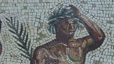 Mosaic with a figure holding a hand on its head and showing a palm tree, Museum of the History of