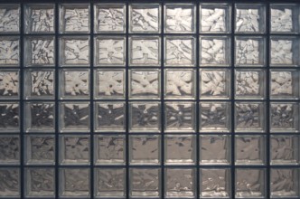 Aesthetic and modern design of textured glass block wall, capturing abstract patterns and light