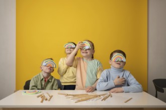 Children engage in a vibrant lesson, creatively using rainbow props to stimulate imagination and