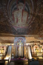 Buddha statues and ceiling fresco in the Dambulla cave temple, Dambulla, Central Province, Sri