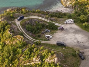 Rest area at Sommaroy Bridge, camper vans, sunset, aerial view, Norway