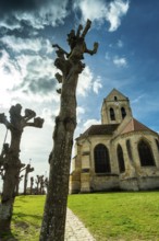 Auvers-sur-Oise. Notre-Dame-de-l'Assomption church painted by Vincent Van Gogh. Val-d'Oise