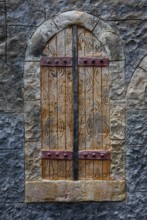 Stone wall with closed wooden window, Plakias, south coast, Crete, Greece