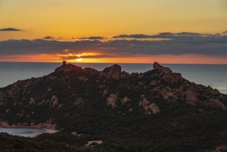 Sunset at the Genoese Tower of Roccapina in southwestern Corsica, France