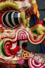 Close-up image of a vibrant and colorful Chinese dragon costume used in the New Year celebrations,