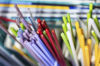 A vibrant collection of Murano and Burano glass rods in a spectrum of colors. This Venetian glass