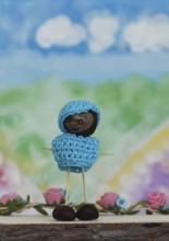 Chestnut figure with hat and jumper in the studio