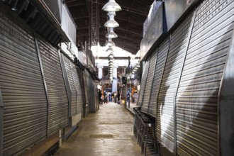 Closed market stalls in the Mercat de la Boqueria, famous market on the Ramblas in Barcelona, Spain