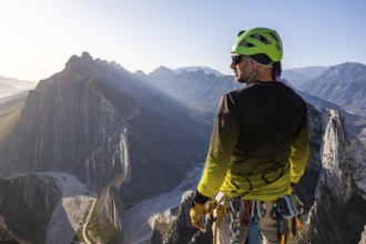 A man pauses to rest while mountaineering and rappelling in Eagleâ€™s Nest, Monterrey, Mexico,