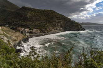 Beach and Genoese tower of La Marine de Negru on the west coast of Cap Corse, Corsica, France