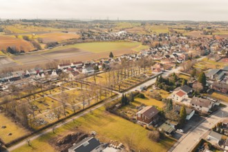 Nice view of a village with trees and fields, the cemetery is visible, Ötisheim, Enzkreis, Germany
