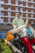 Two individuals at a day center participate in gardening, nurturing plants in an outdoor garden.