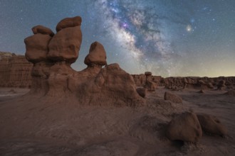 Captivating view of the Milky Way galaxy shining brightly over the unique hoodoo rock formations of
