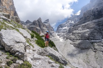 Female hiker in the mountains, Castelletto Superiore and Cima Sella, back Scharte Bocca di Tuckett,