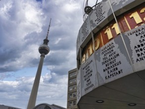 Cloudy sky over the Berlin World Clock and the Berlin TV Tower at Alexanderplatz, Alex, Mitte,