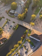 Aerial view of a section of a river with a bridge and surrounding buildings, Calw, Black Forest,