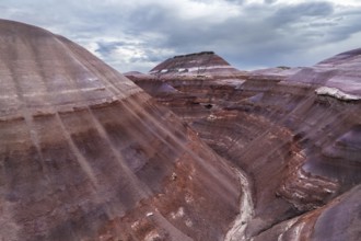 A stunning drone photograph capturing the layered geological formations unique to Hanksville, Utah,