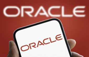 Oracle logo is diaplayed on smartphone. Oracle Corporation is an American multinational computer