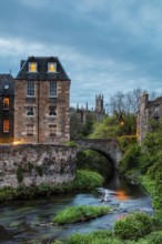Dean Village, Edinburgh, Scotland, UK. Traditional houses and church with canal in historic Dean