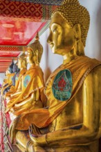 Historic Buddha statues at Wat Pho Temple, sitting, seated, Buddhism, religion, world religion,