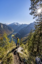 Mountaineers at the Archenkanzel viewpoint, panoramic view of the Königssee, autumn forest and