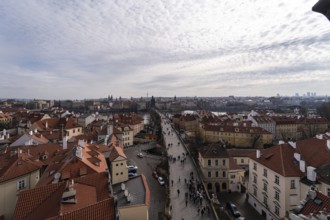 Beautiful aerial snapshot of Prague showcasing a crowded street flanked by traditional terracotta