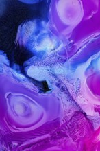 Vivid abstract liquids art featuring swirling patterns in shades of blue and purple, creating a