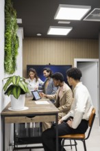 An inspiring office setting where professionals engage in a collaborative meeting. Modern decor,