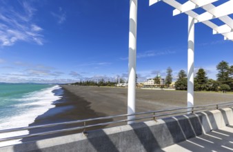 Overlooking the sandy shore of Hawke Bay, this image captures Napier's distinctive art deco