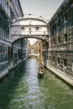 Gondolier, gondola boat on the canal, Ponte dei Sospiri, Bridge of Sighs, Venice, Italy 1969