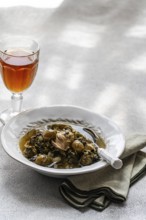 Traditional Chakapuli, a Georgian dish of stewed lamb with tarragon, coriander, green onion, and