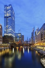 Skyline skyscrapers skyscrapers on the Chicago River bridge at night in Chicago, USA