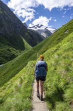 Mountaineer on a hiking trail in Umbaltal, Venediger Group, Hohe Tauern National Park, East Tyrol,