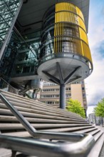 Modern building design with glass façade and yellow blinds in an urban environment, Berlin, Germany