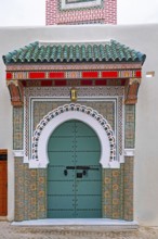 Decorated green door, entrance to mosque in medina of the city Tangier, Tanger, Morocco