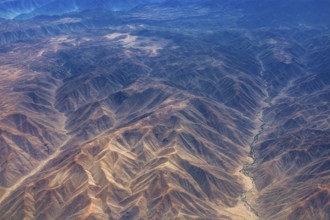 Breathtaking mountain formations in an arid desert region seen from the air, the landscape and