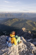 Hiker looking down into the valley from the Hochkönig, Tyrol, Austria