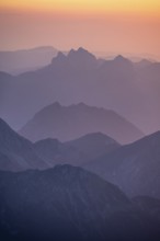 Silhouettes of mountains at sunset, view from the summit of the Zugspitze, Wetterstein Mountains,