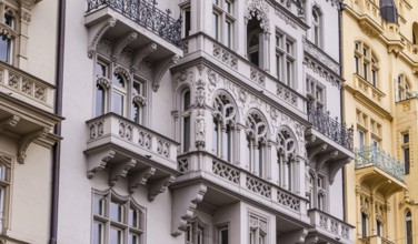 Detailed view of historic Prague facades, showcasing intricate designs and architectural elegance.