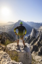 A man pauses on a rocky ledge in Eagleâ€™s Nest, Monterrey, Mexico, after a session of