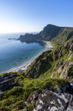 View of coastal landscape, cliffs with peak Måtind or Måtinden, Høyvika beach and sea, hike to the