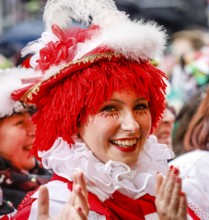 Colourfully costumed carnivalists celebrate carnival in Cologne, on Weiberfastnacht the street