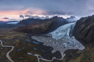 Stunning aerial shot capturing the expansive Vatnajökull Glacier winding through rugged mountains
