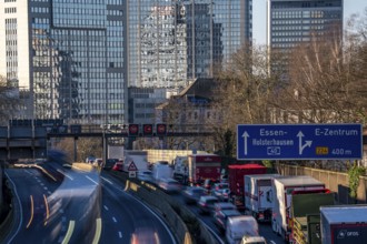 The A40 motorway, Ruhrschnellweg, in Essen, city skyline, Evonik office building, traffic jam in